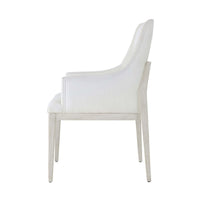 Side profile of white upholstered dining chair.