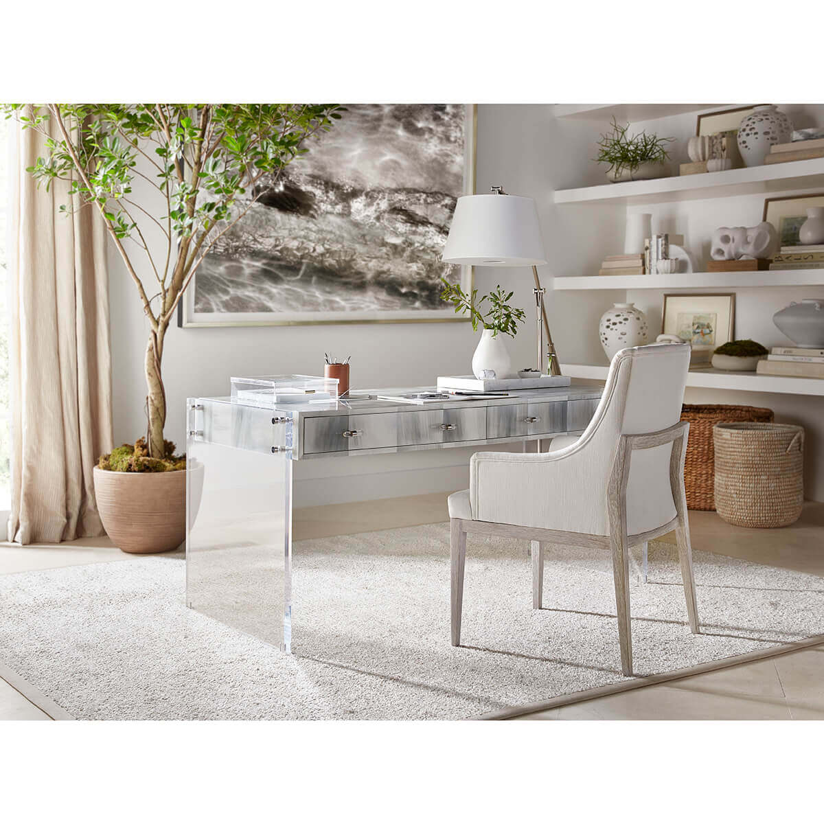Office setting with coastal-style white upholstered armchair.
