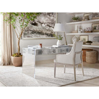 Office setting with coastal-style white upholstered armchair.