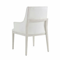 White upholstered armchair, back view, dining chair.