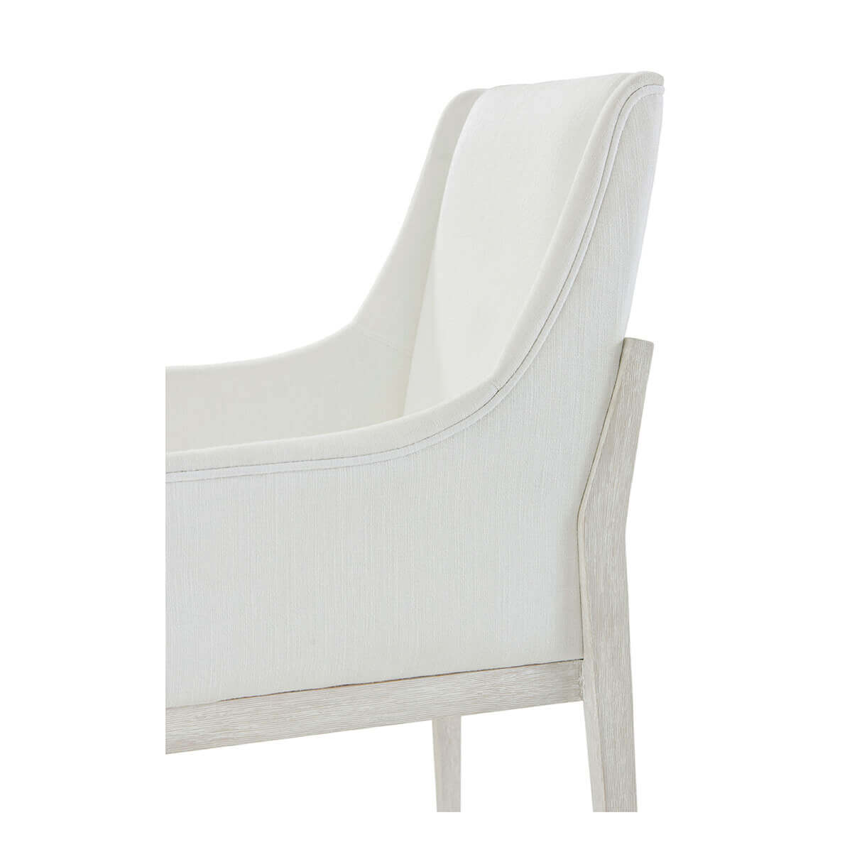 Close-up arm detail of upholstered dining chair.