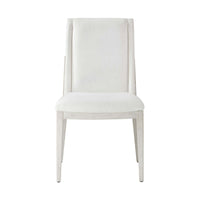 White upholstered dining chair, front view close-up.