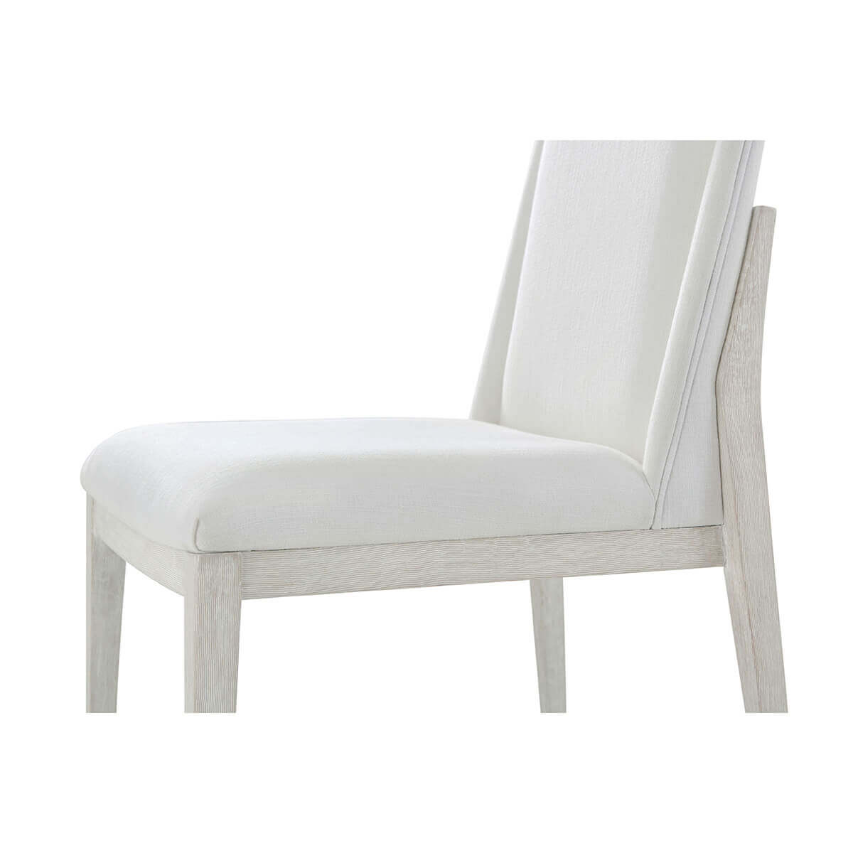 White upholstered dining chair, side detail of seat.