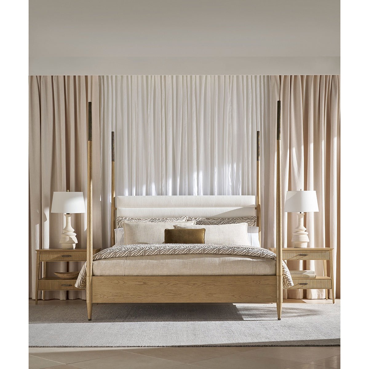 Coastal mid-century oak bed, full room setup, lamps visible.
