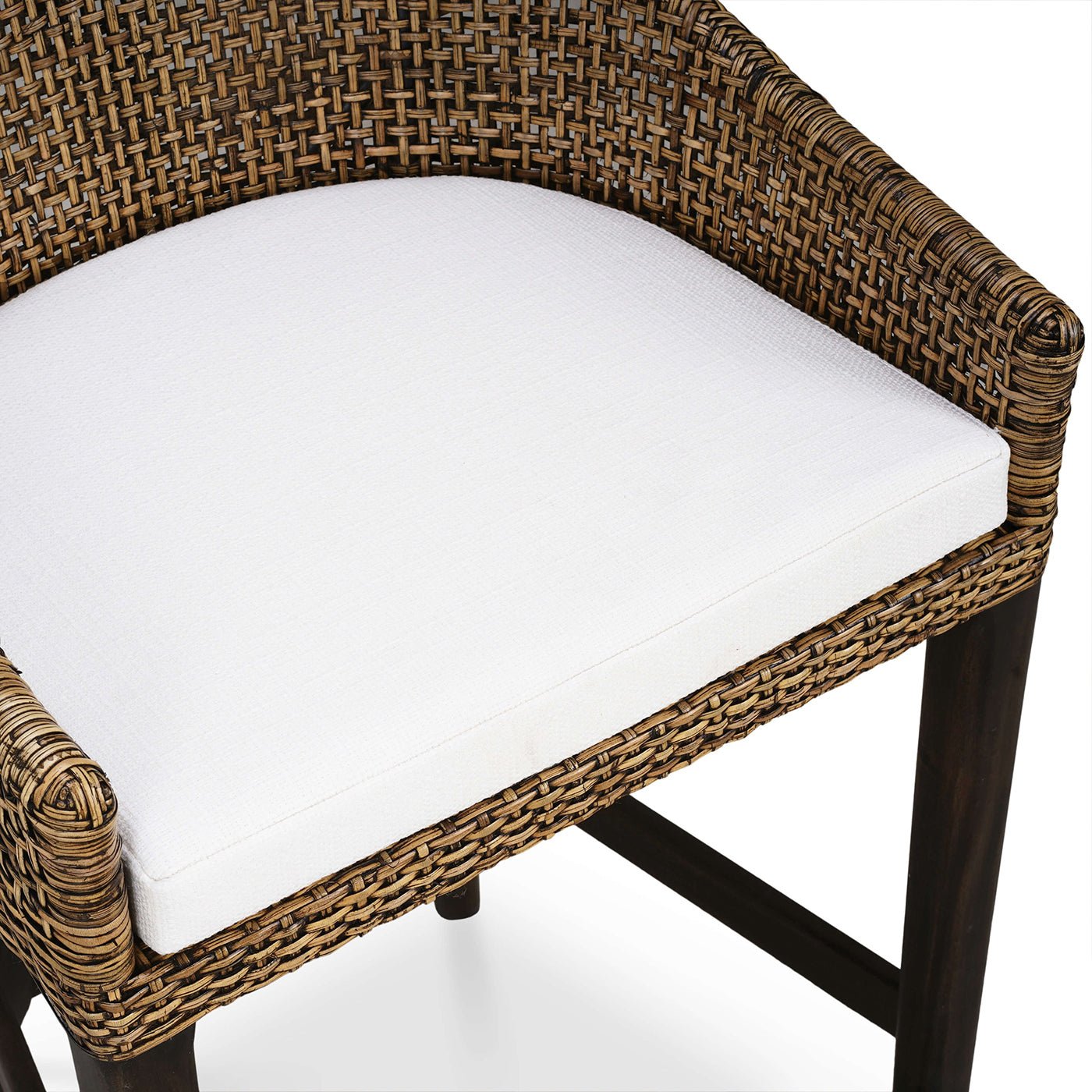 Top view of white cushion on rattan barstool.