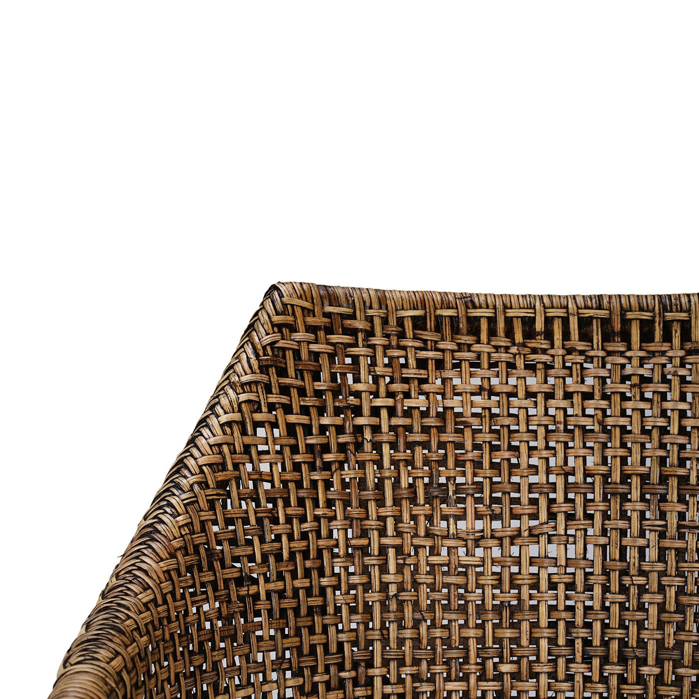 Close-up of rattan weave texture on counter stool.