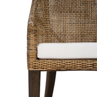 Detail of cushion and woven rattan on dining chair.