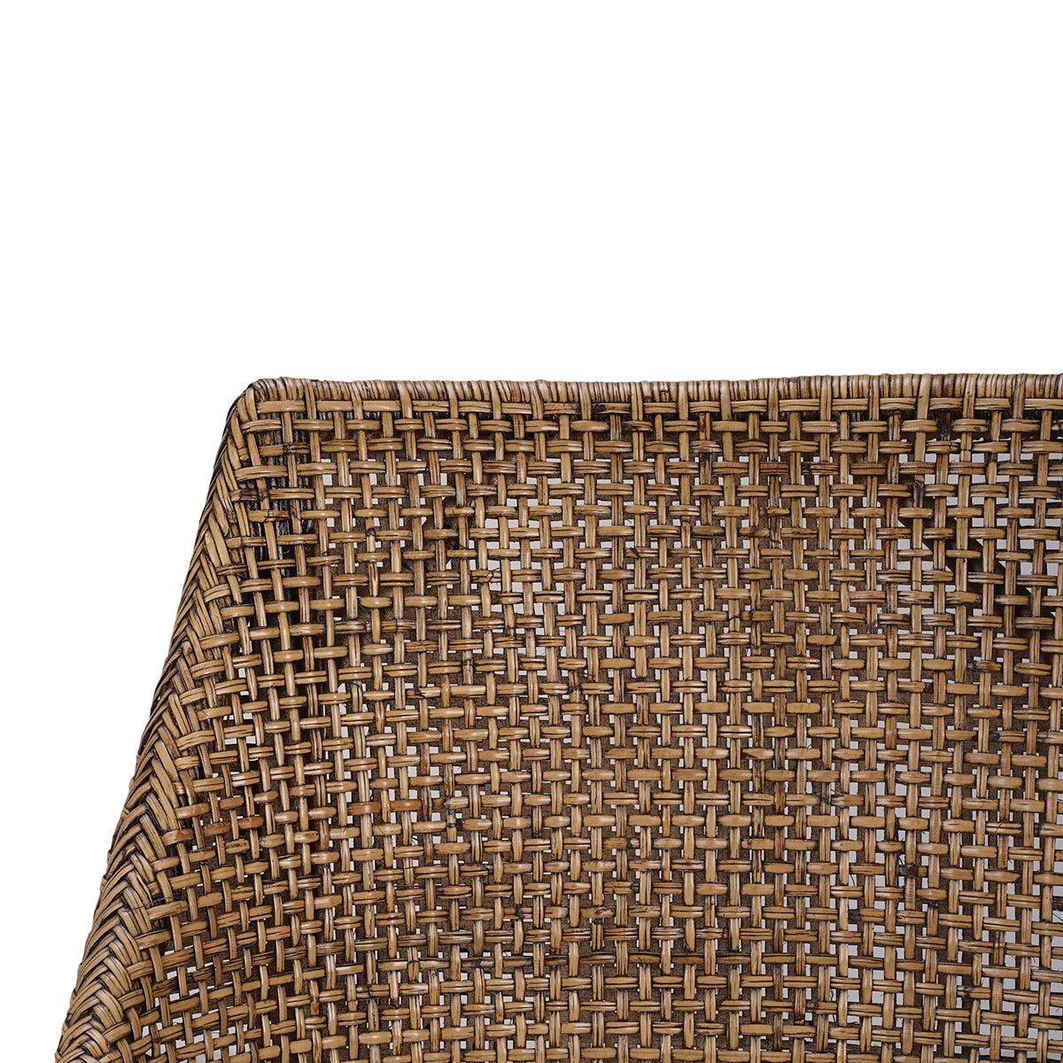 Close-up of woven rattan texture on dining chair.