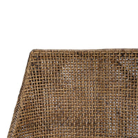 Close-up of woven rattan texture on dining chair.