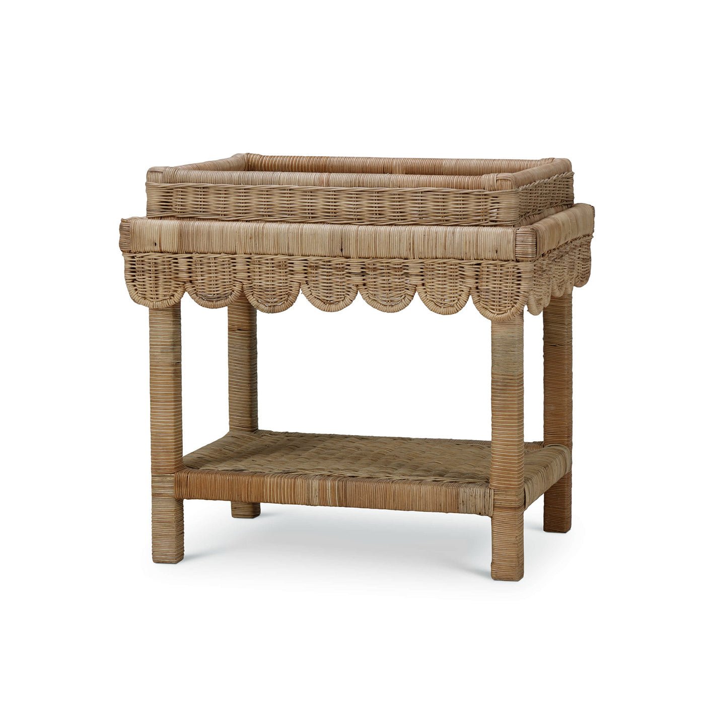 Rattan table with scalloped edge, angled front view.