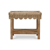 Rattan table with scalloped edge, straight back view.