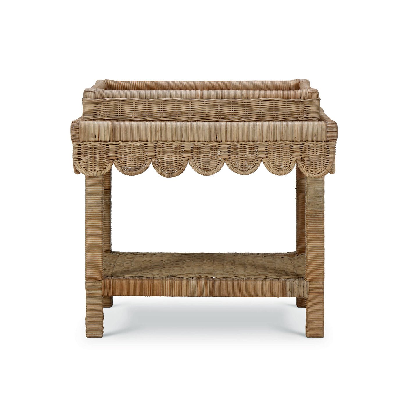 Rattan table with scalloped edge, front view.