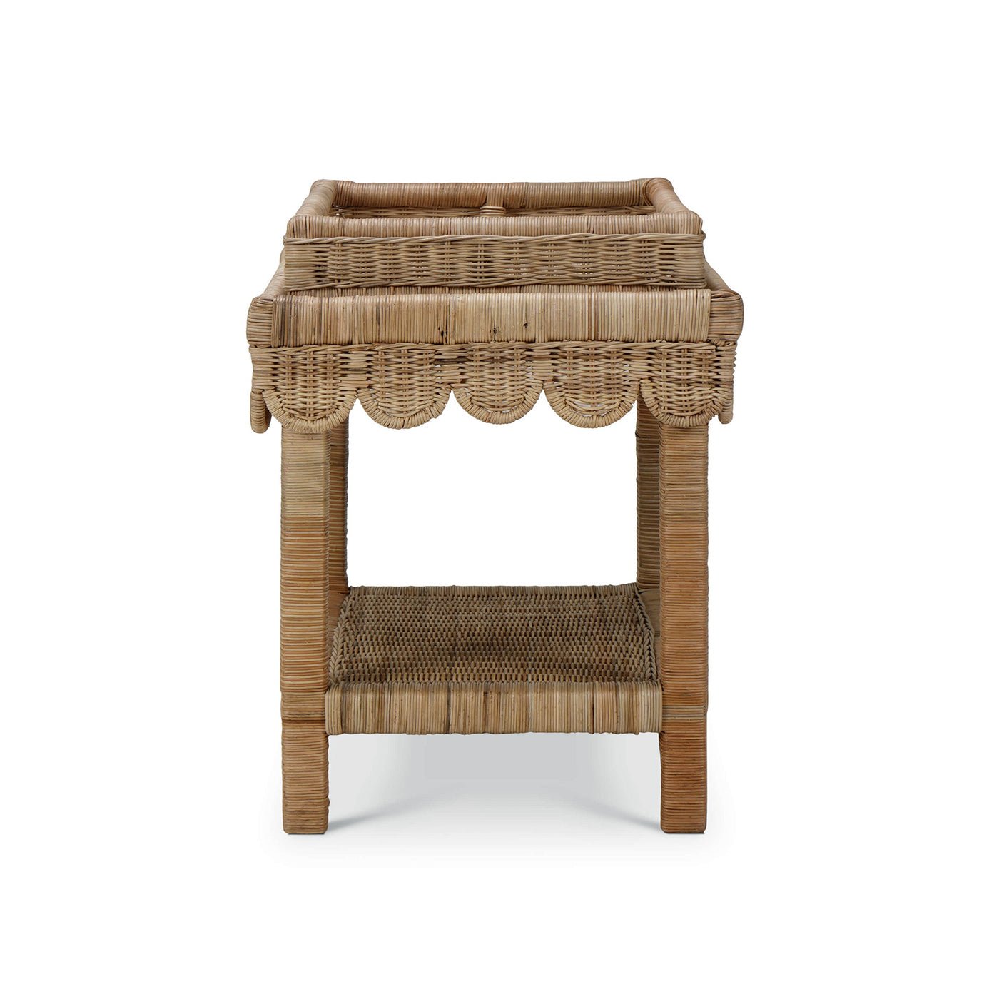 Rattan table with scalloped edge, side view.