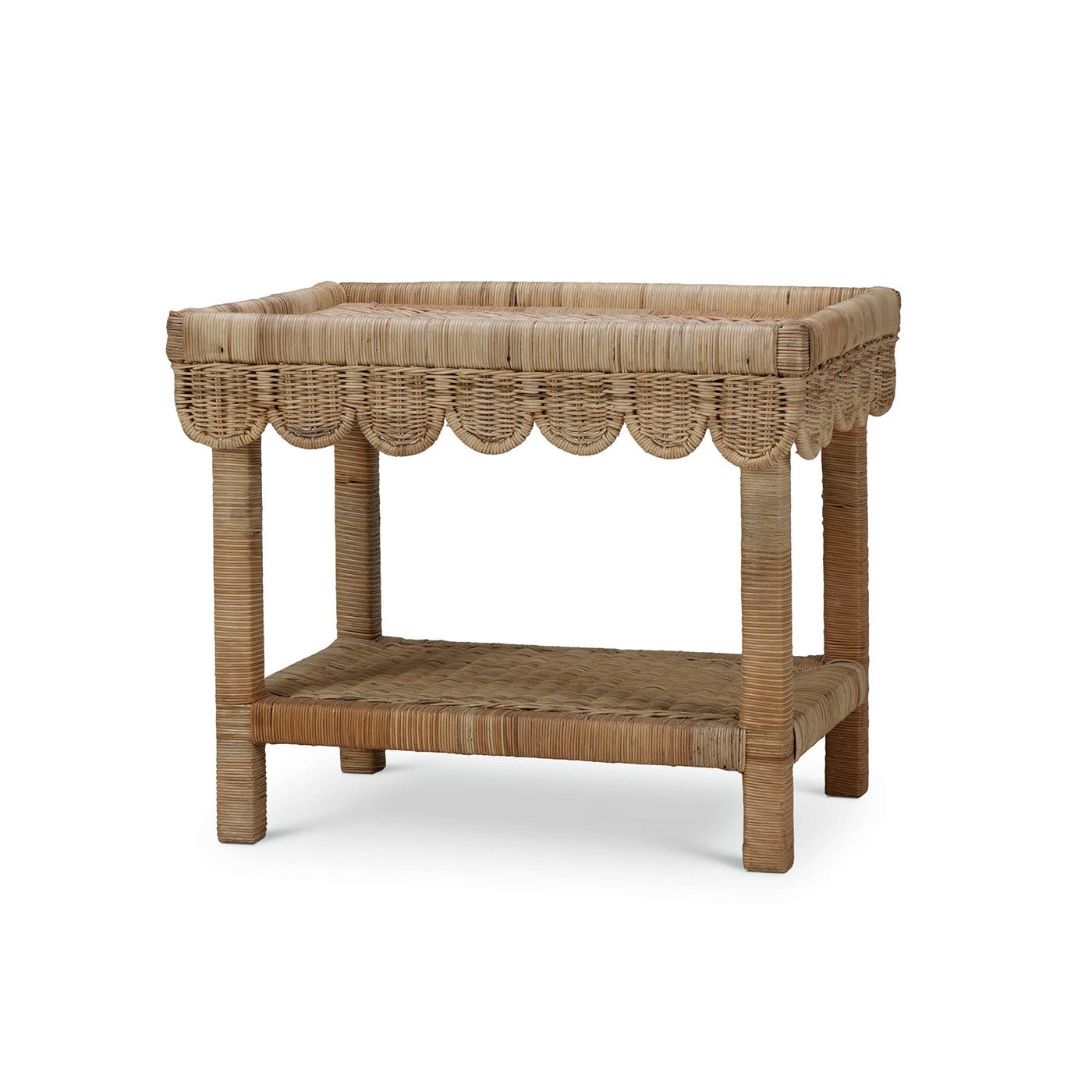 Rattan table with scalloped edge, angled back view.