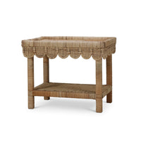 Rattan table with scalloped edge, angled back view.