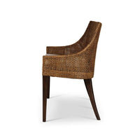 Side profile of coastal rattan settee with cushion.
