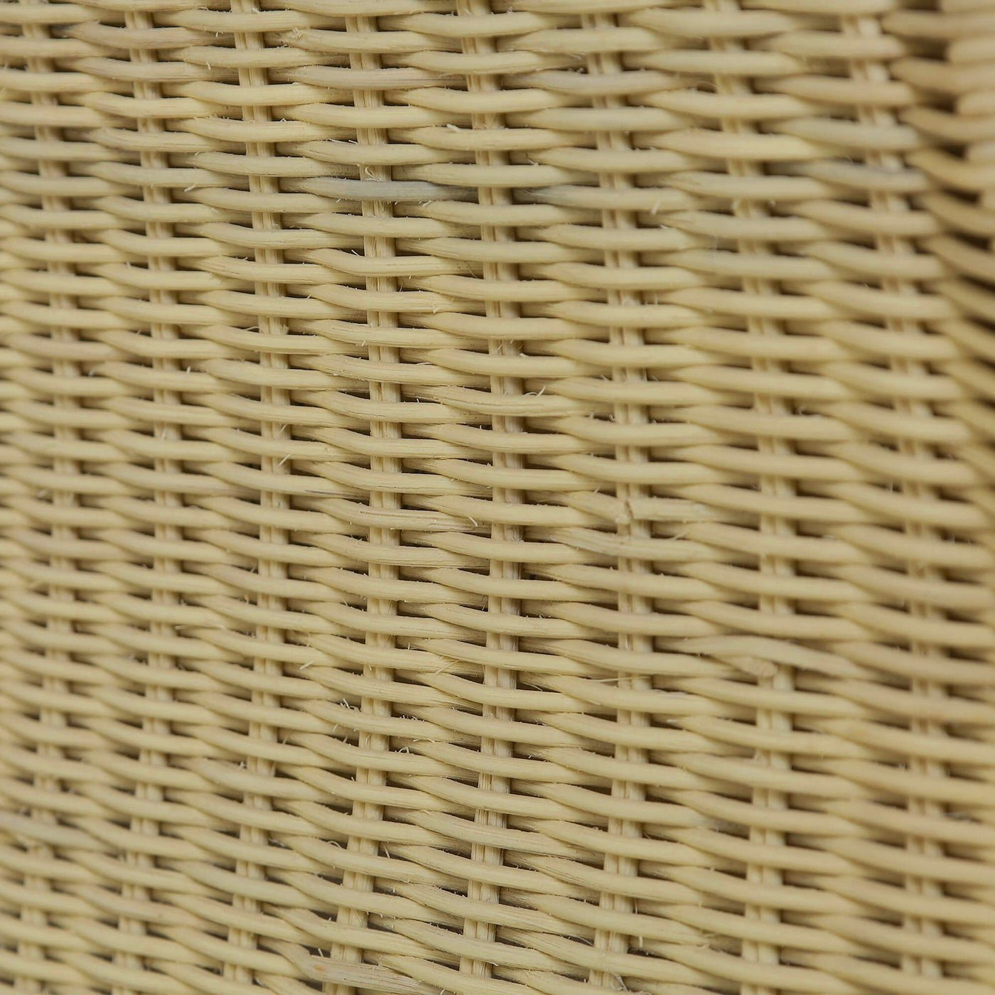 Close-up of wicker texture on rattan settee surface.