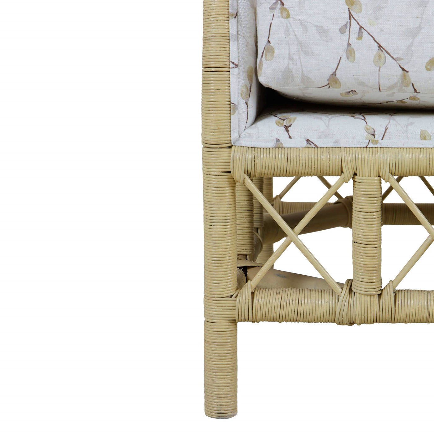 Detail of rattan frame and upholstery on settee corner.