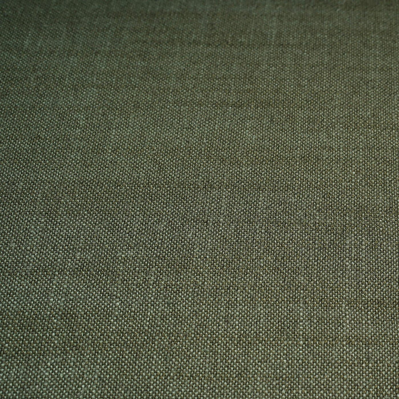 Fabric texture of green rattan settee upholstery.