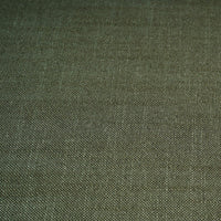 Fabric texture of green rattan settee upholstery.