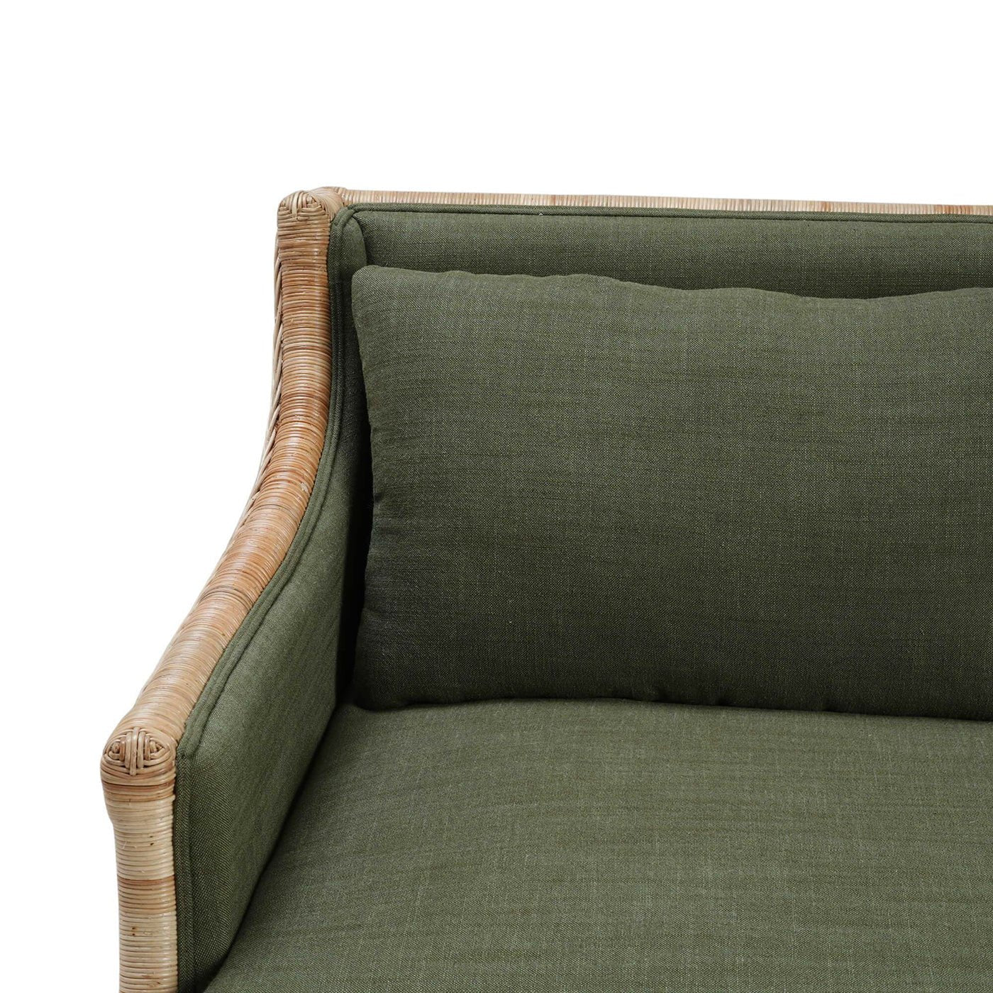 Close-up of rattan settee arm and cushion.