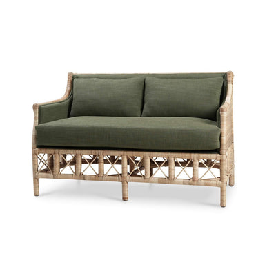 Rattan settee with green cushions, angled view.