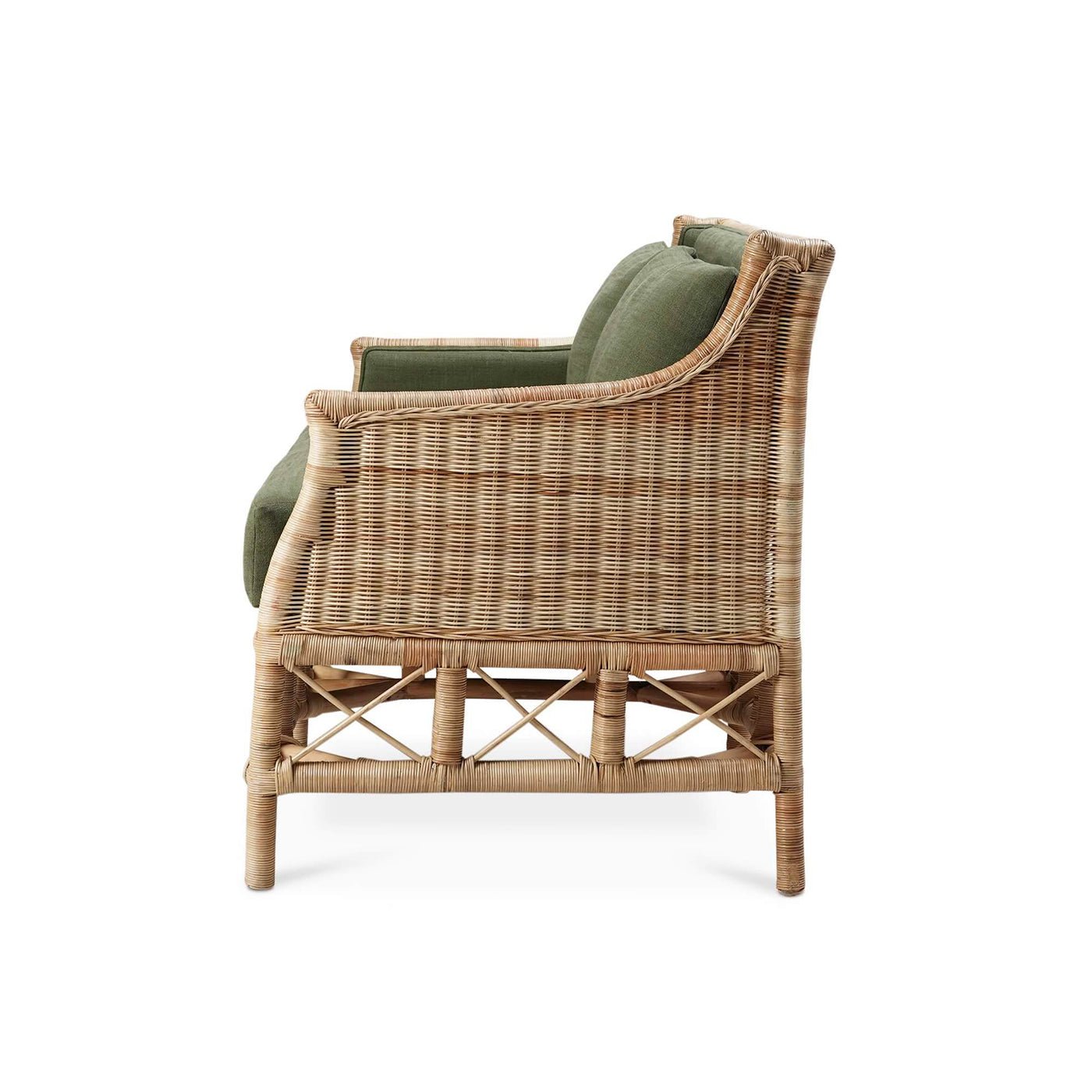 Side view of rattan settee with green upholstery.