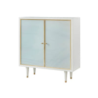Modern coastal cabinet with glass doors and gold trim.