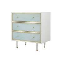 White nightstand with blue drawers, gold accents, side view.