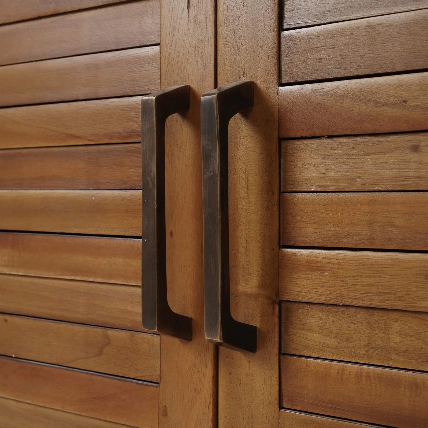Close-up of coastal sideboard handles and textured doors