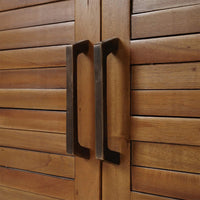 Close-up of coastal sideboard handles and textured doors