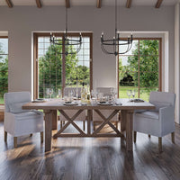 Rustic dining room with white slipcovered armchairs.