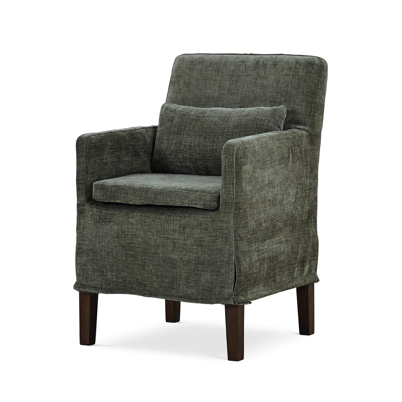 Green slipcovered dining armchair, three-quarter view.