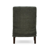 Green slipcovered dining armchair, back view.