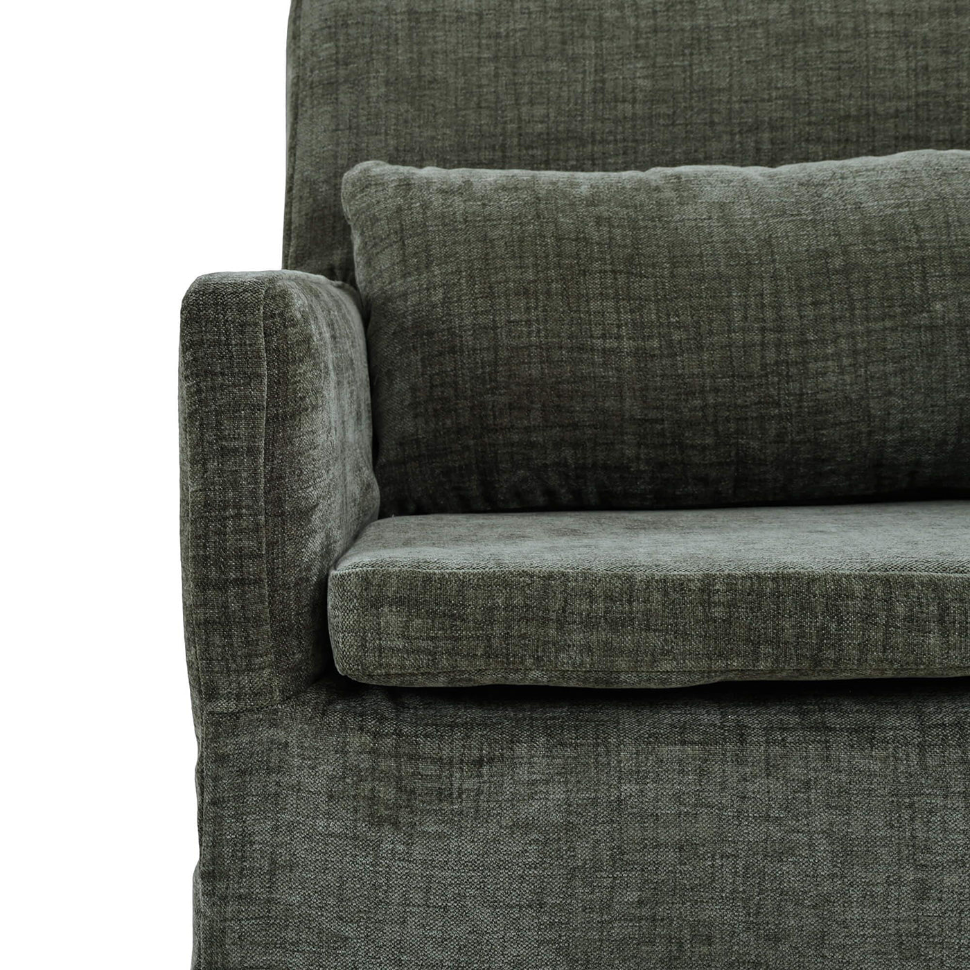 Green slipcovered dining armchair, partial front with cushion.