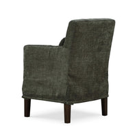 Green slipcovered dining armchair, back three-quarter view.