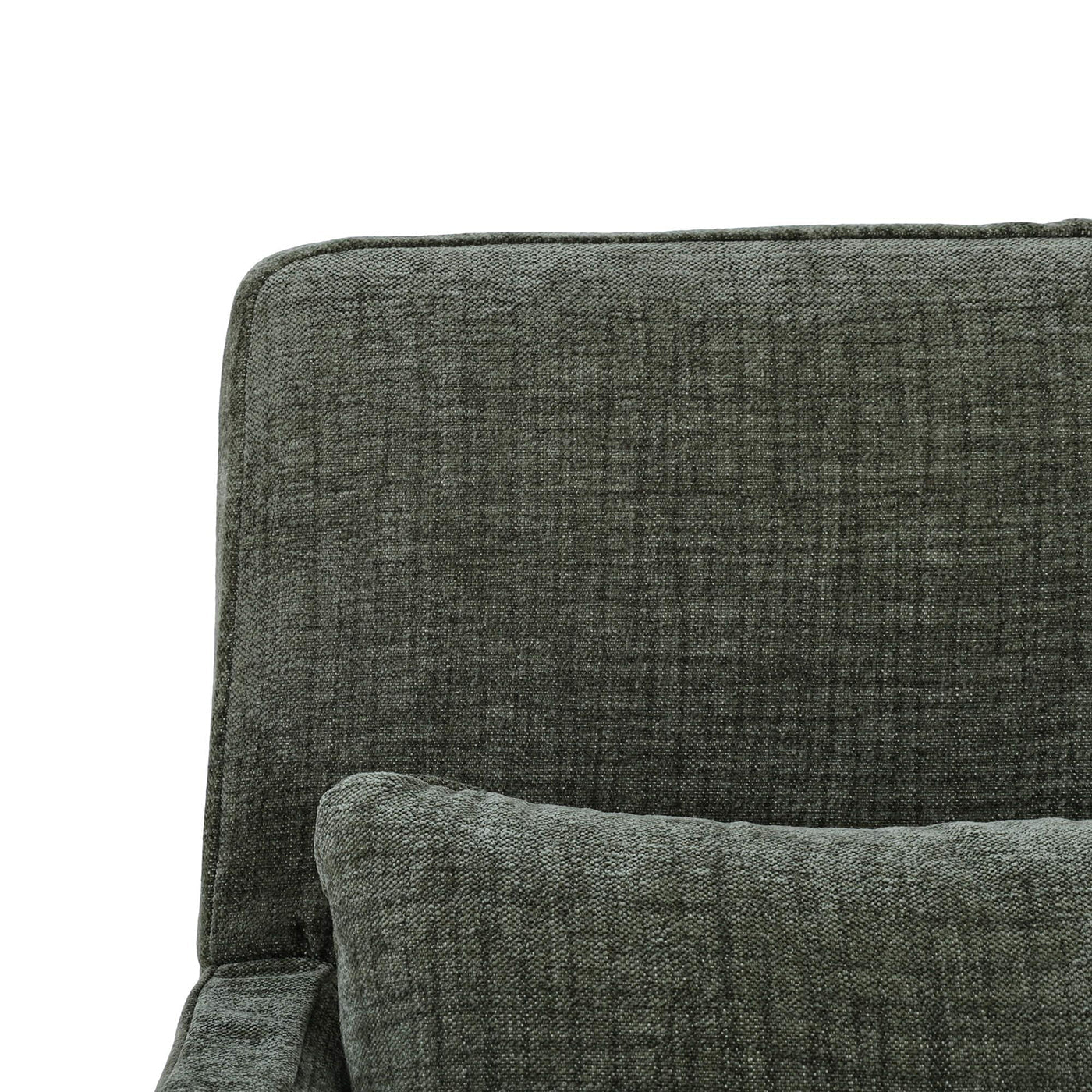 Green slipcovered armchair, close-up of back and pillow.