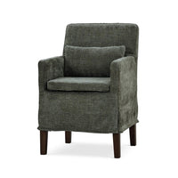 Green slipcovered dining armchair, front-angle view.