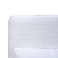 Close-up of white slipcovered chair fabric texture.