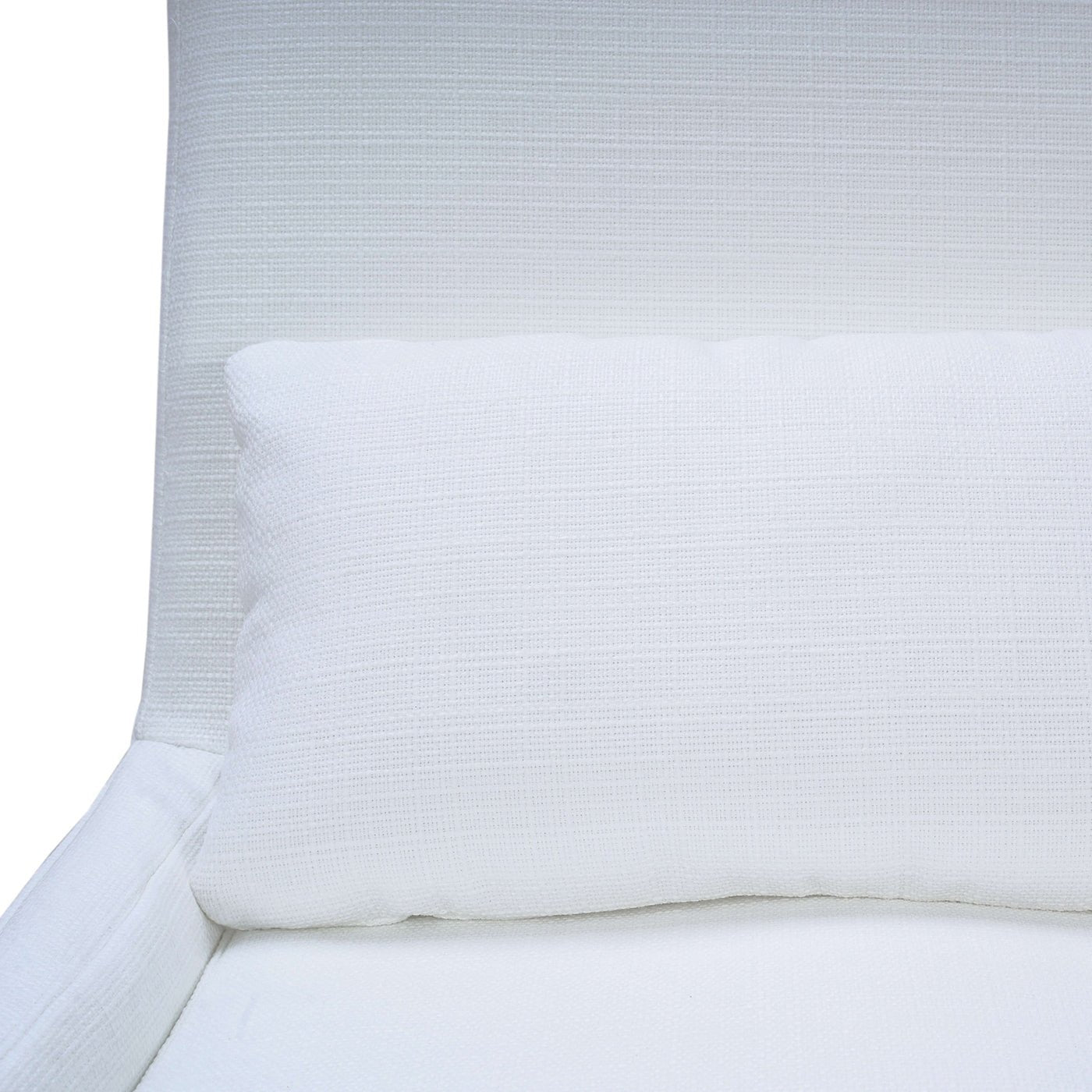 Close-up of cushion on white dining chair.