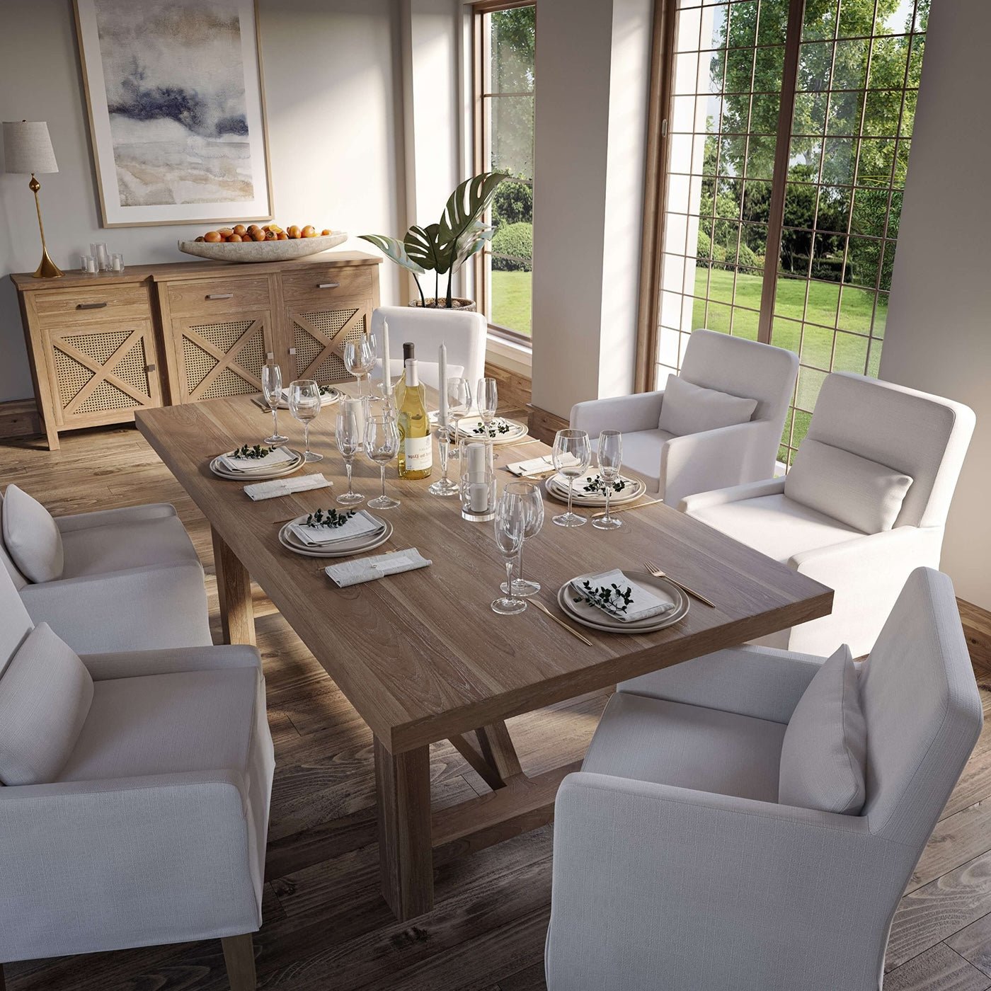 Top view of dining table setup with slipcovered chairs.