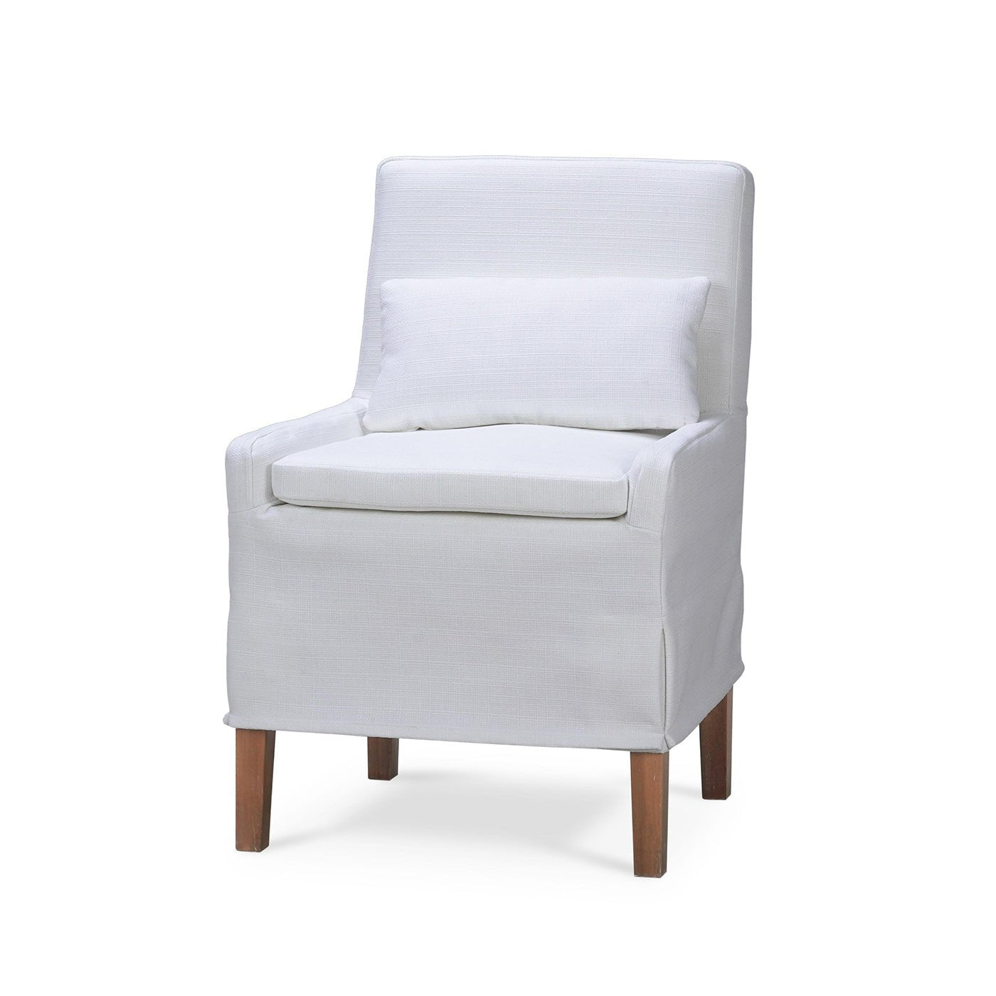 White slipcovered dining chair with pillow, front view.