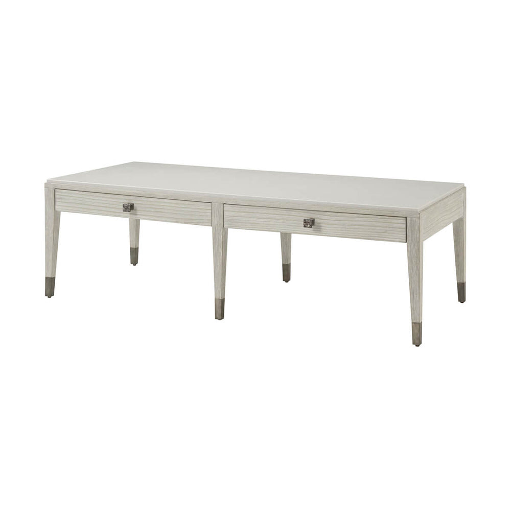 Coastal style cocktail table angled view, drawers visible.