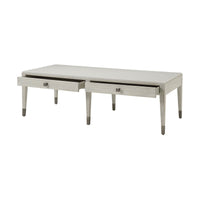 Coastal style cocktail table with open drawers, modern design.