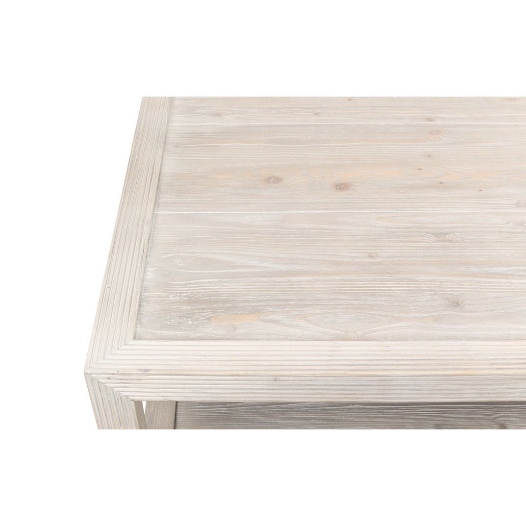 Close-up of table edge, wood finish visible.