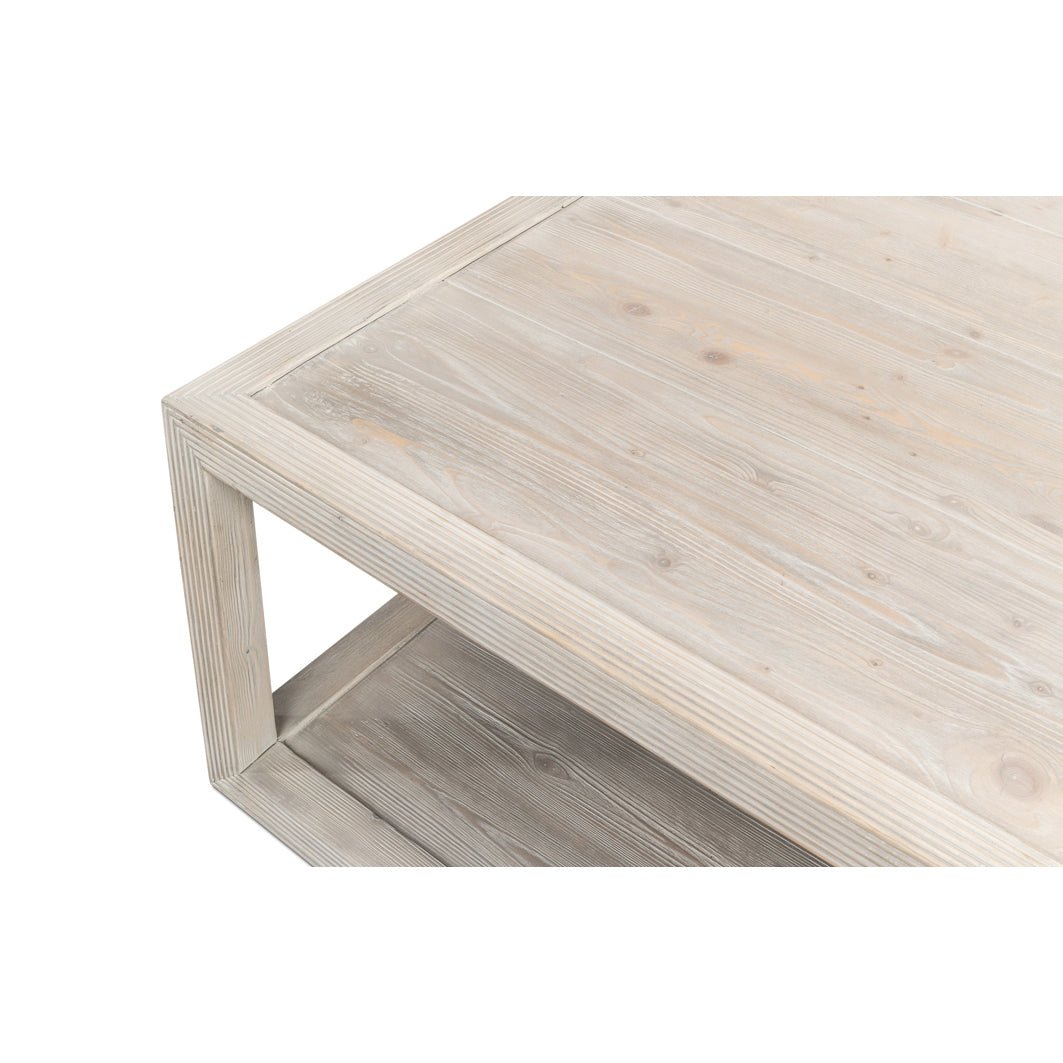 Close-up of coffee table corner, wood grain detail.