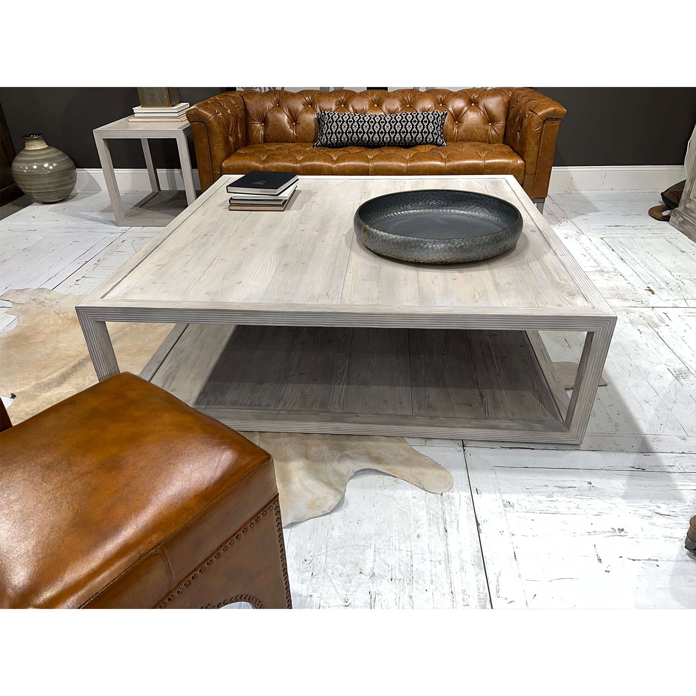 Coffee table, angled view with books and tray.