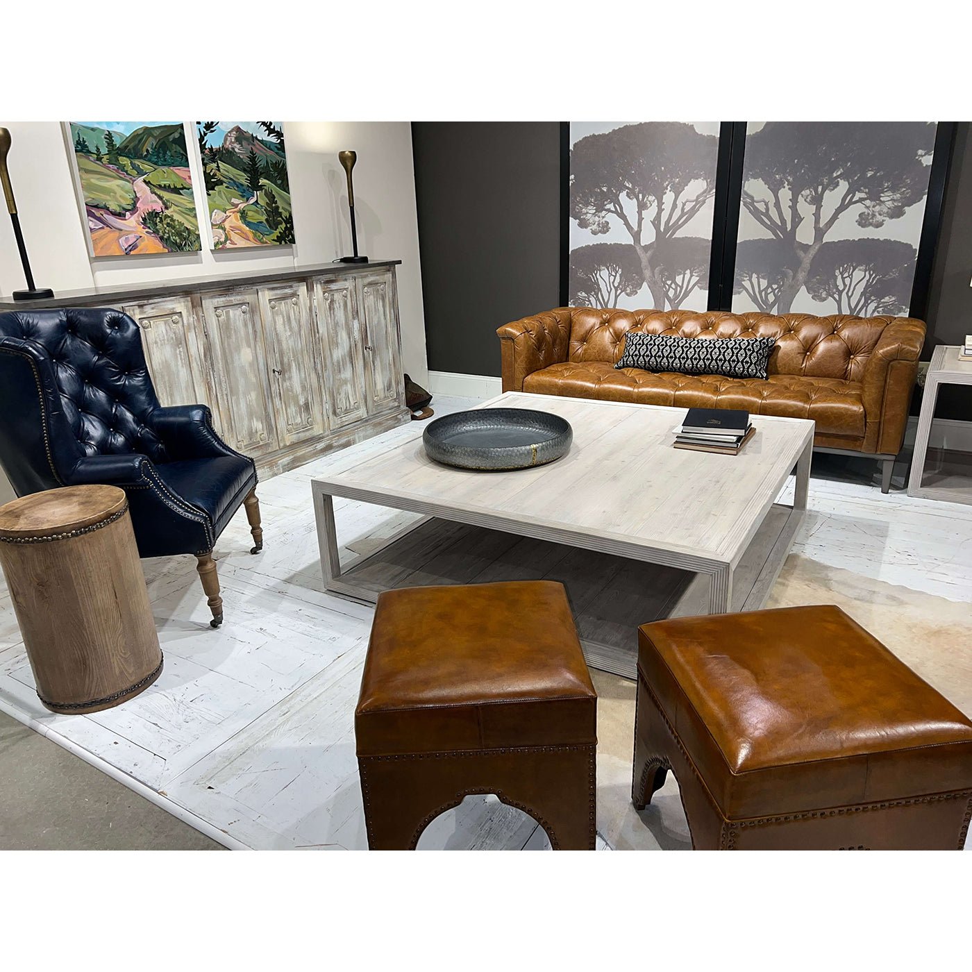 Coffee table in living room setup, leather sofa background.