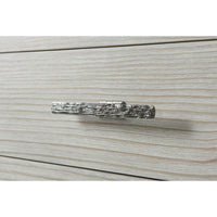 Detailed view of handle on coastal painted chest.