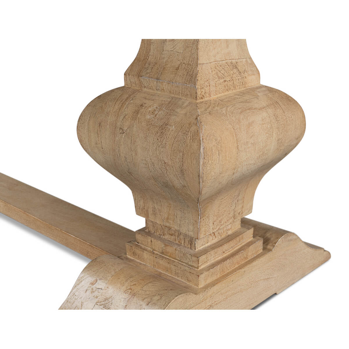 Close-up of dining table pedestal with detailed carving.